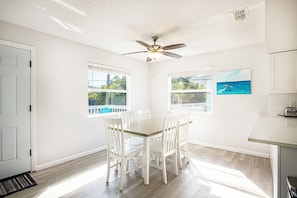 Dining - RENOVATED! Spacious 2-bed, 2-bath second-floor unit minutes from Indian Rocks Beach. Sleeps nine with full kitchen, WiFi, smart TV, beach gear, parking, and direct pool access. A comfortable, convenient stay for families and groups (Indian Rocks Beach)