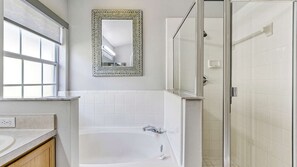 Combined shower/bathtub, hair dryer, towels, soap