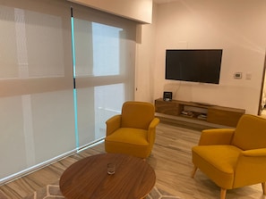 50-inch flat-screen TV with cable channels, TV - Cozy 5th Avenue Apartment with roof pool By 369 (Playa del Carmen)