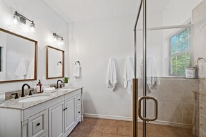 Combined shower/tub, hair dryer, towels, soap