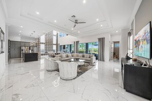 TV, fireplace, video games - Tranquility at Bear's Den: Private Pool, Theater, Grill, Free Water Park, Golf View, Near Disney (Kissimmee)