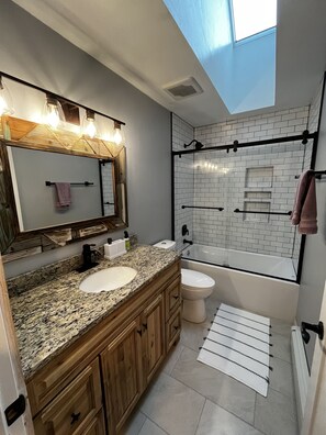 Combined shower/tub, hair dryer, towels, toilet paper