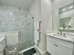 Combined shower/tub, hair dryer, towels, soap