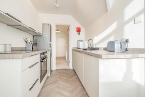 Apartment, 1 Queen Bed | Private kitchen | Fridge, microwave, oven, stovetop