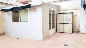 A small, enclosed room with a window, a door, and a tiled floor. - Apartment in Albacete center (Albacete)