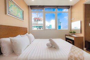 Desk, laptop workspace, blackout drapes, iron/ironing board - Ben Thanh - Luxury Serviced Apartments (Ho Chi Minh City)