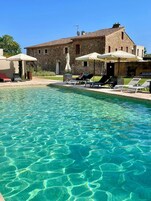 Seasonal outdoor pool, open 10:00 AM to 8:00 PM, pool umbrellas