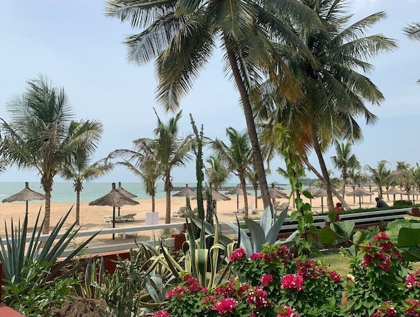 On the beach, sun-loungers, beach towels