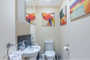 Combined shower/tub, hair dryer, towels, soap