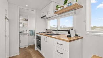 Fridge, microwave, stovetop, coffee/tea maker