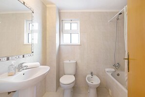 Bathtub, hair dryer, towels