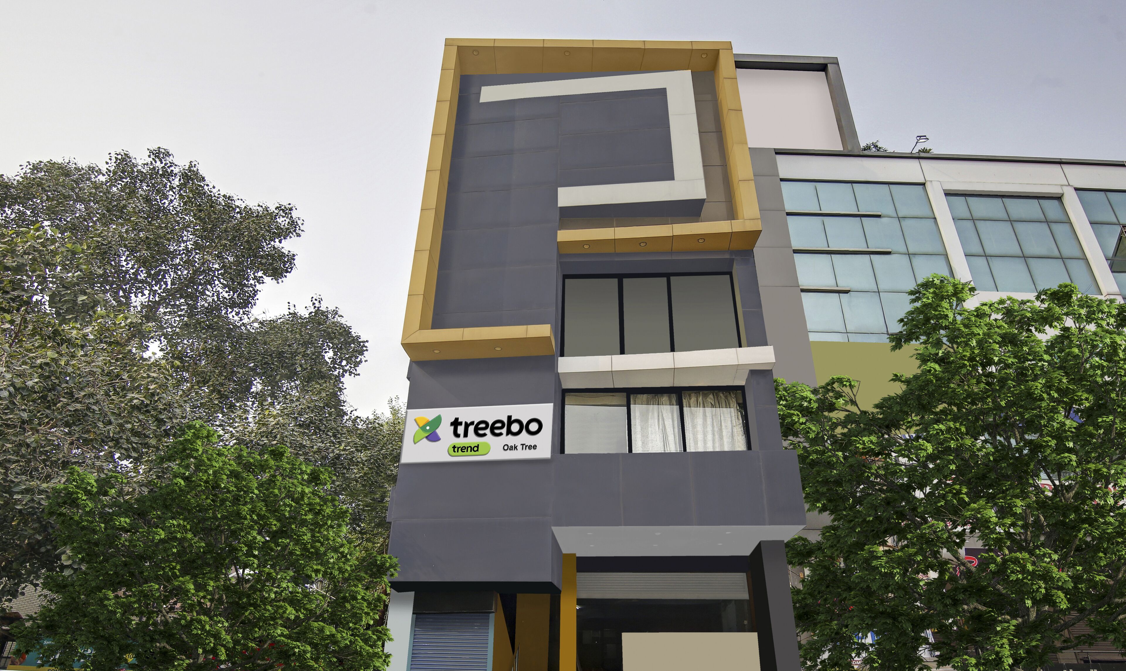 A modern building with a sign for 'treebo' on the facade.