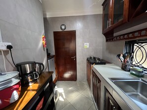 Fridge, microwave, stovetop, coffee/tea maker