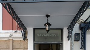 A staircase leading to a door labeled "NAYAPINOY 4".