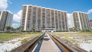 A multi-story hotel with a central walkway leading to the entrance. - Great Rates! Book Now and Save*2BR/2BA On Beach*Sleeps 8*7th floor (Orange Beach)