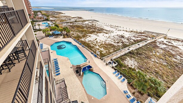 A hotel with a pool area, beach view, and a boardwalk. - Great Rates! Book Now and Save*2BR/2BA On Beach*Sleeps 8*7th floor (Orange Beach)