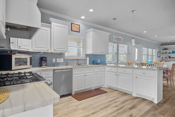 Enjoy cooking in this well-equipped kitchen with ample counter space and a central island.