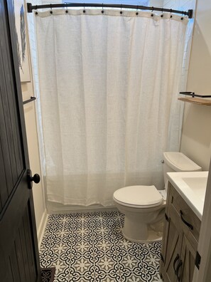 Bathtub, hair dryer, towels, soap