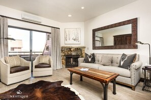 TV, fireplace, books - The Lodge at Mountain Village | Gorgeous Ski-In/Ski-Out Condo | A Nestique Property (Park City)