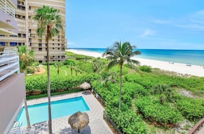 Outdoor pool, a heated pool - Somerset 404..Newly Remodeled Beach Front. 3 Bdrm 3 Bath, Den w/ Sofa Sleeper (Marco Island)