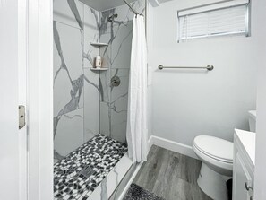 Combined shower/tub