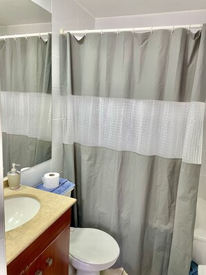 Standard Apartment, 1 Bedroom | Bathroom | Combined shower/tub, rainfall showerhead, hair dryer, soap - AcuñayDonoso ApartamentosCentro  (Santiago)