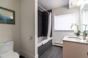 Shower, hair dryer, towels, shampoo