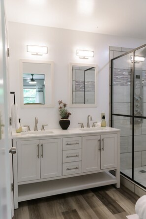 Shower, hair dryer, towels, toilet paper