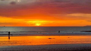 On the beach, sun loungers, beach towels