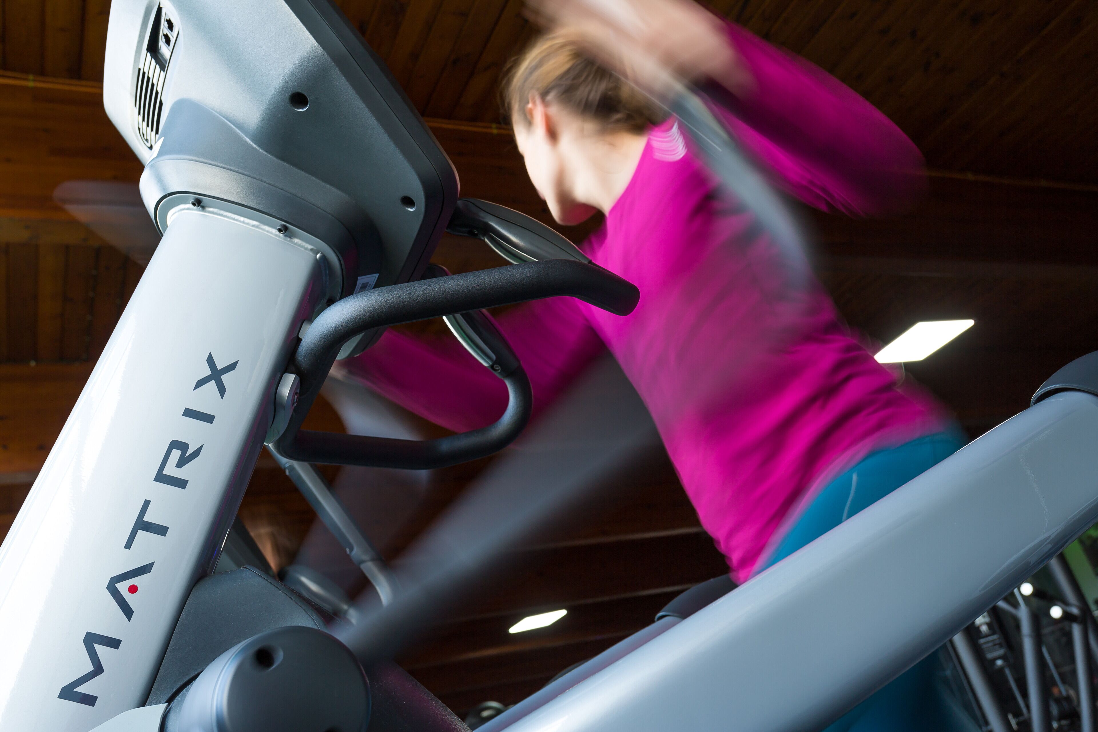 A stationary exercise bike with the brand name MATRIX.