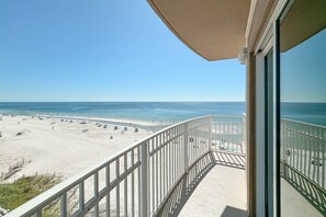 A balcony with a view of a beach and ocean. - Crystal Shores West 101- Enjoy the View of Paradise (Gulf Shores)