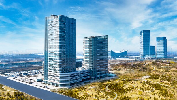 A modern high-rise building complex with multiple skyscrapers, surrounded by a landscaped area with pathways and greenery. - Shanxi Xiaohe Xincheng Talent Apartment (Taiyuan)