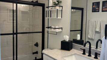 Combined shower/tub, hair dryer, towels, soap