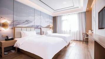 A modern hotel room with two beds, a desk, and a large window.