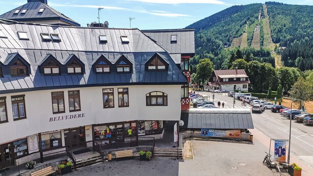 A building with a sign reading "BELVEDERE" and a medical center sign nearby. - Skylight Escape by Interhome (Harrachov)