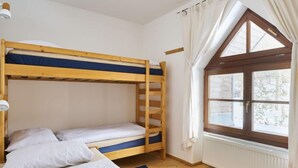 A bunk bed room with a window and a radiator. - Skylight Escape by Interhome (Harrachov)