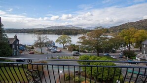 A residential area with a view of a lake and mountains.