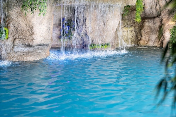 Indoor pool, seasonal outdoor pool, pool umbrellas, pool loungers