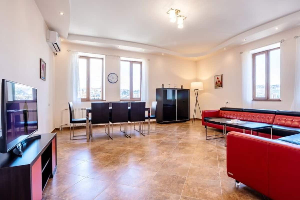 Family Apartment | Living area | 55-inch flat-screen TV with cable channels