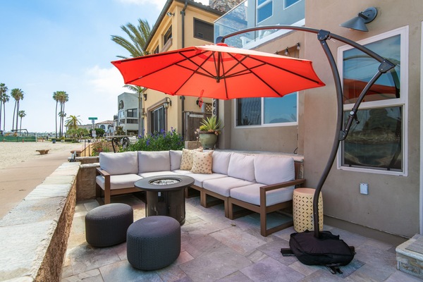 This ground-floor patio, overlooking the bay, offers ample seating for outdoor lounging.