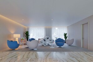 Un salon moderne avec un sol en marbre, des meubles contemporains et de grandes fenêtres ornées de rideaux légers.