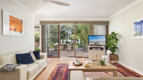 Sunset at The Moorings – newly renovated townhouse on the beach with manicured gardens and pool