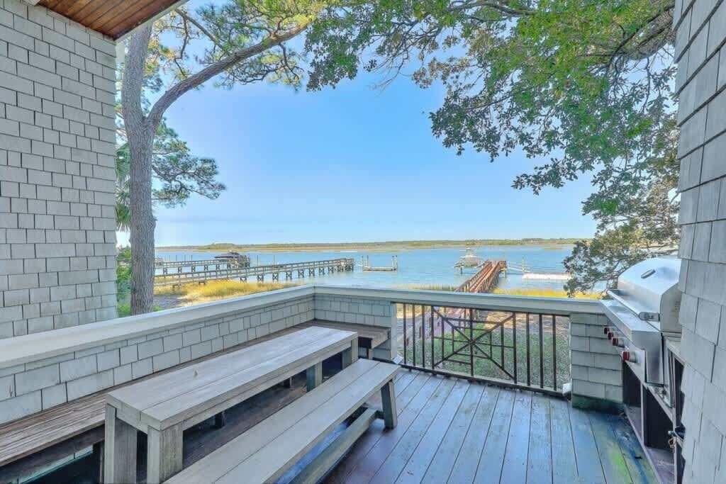 Outdoor dining area with breathtaking waterfront views, perfect for family meals and sunsets.