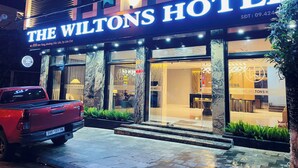 The Wiltons Hotel with a red pickup truck parked in front. - THE WILTONS HOTEL LAO CAI (Lao Cai)