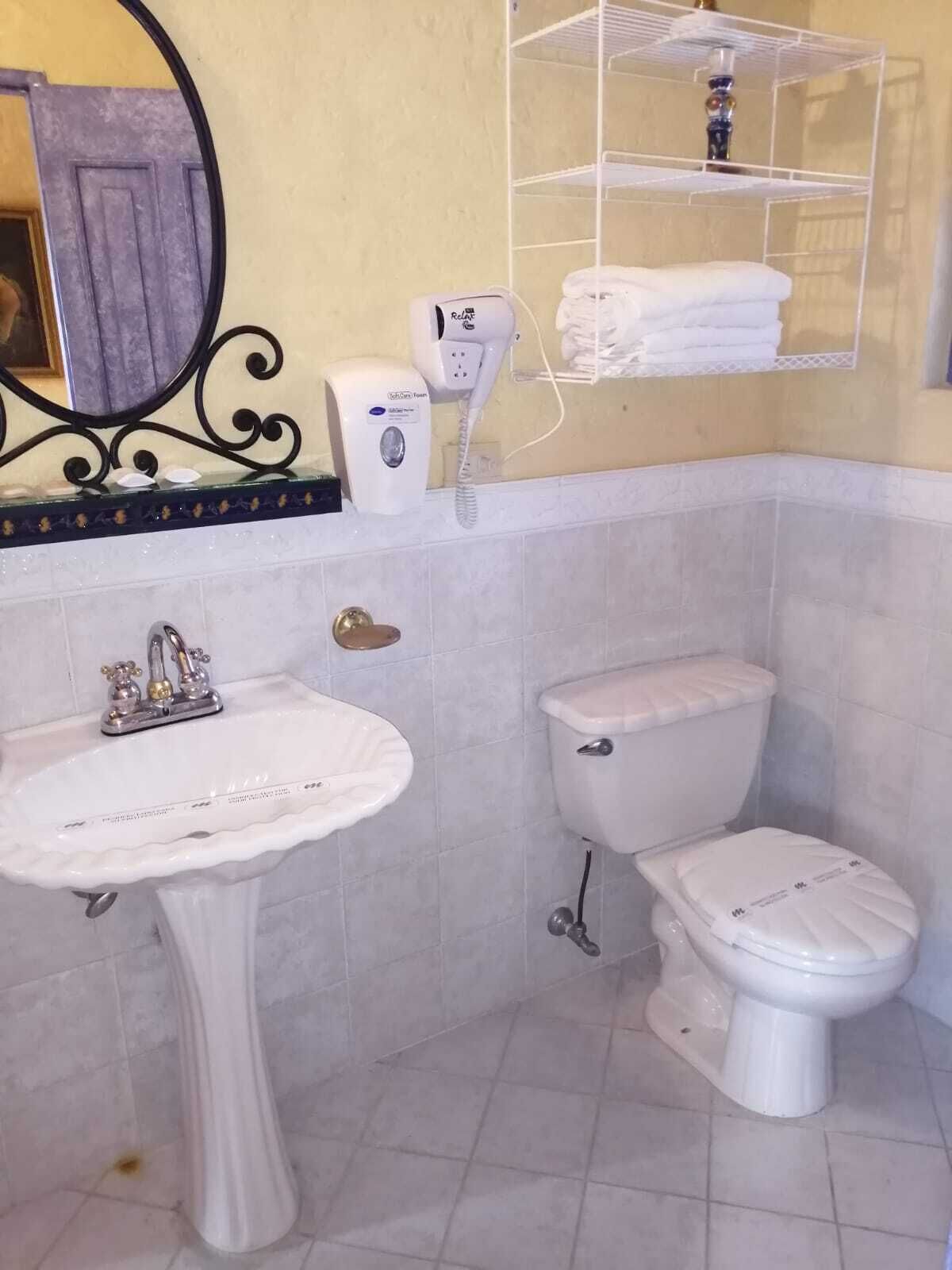 grand twin room | bathroom | rainfall showerhead, hair dryer, towels