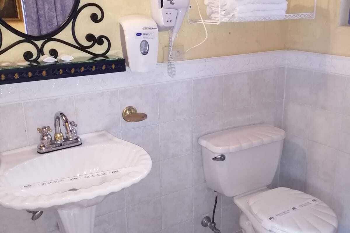 grand twin room | bathroom | rainfall showerhead, hair dryer, towels