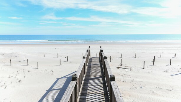 A wooden boardwalk leading to a beach with a clear sky. - Oceanfront 7 BR Beach House with a Private Pool! Royal Palm (Garden City)
