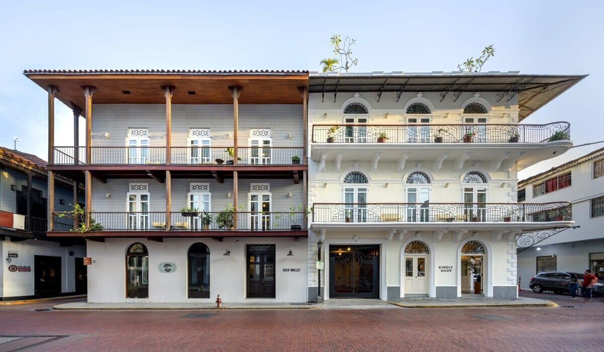 A two-story building with a ground-floor shop and upper-floor apartments.