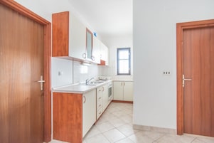 Apartment (Two Bedroom Apartment with Balcony) | Private kitchen | Fridge