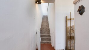 A narrow hallway with a staircase leading to a higher floor. - 1852 Villa Nataly - Primo Piano by Barbarhouse (Lecce)